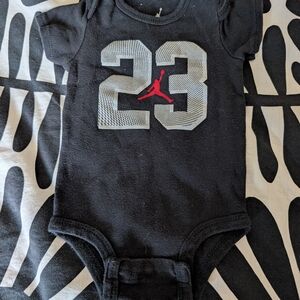 Black Baby Onesie with Number 23 and Red Logo